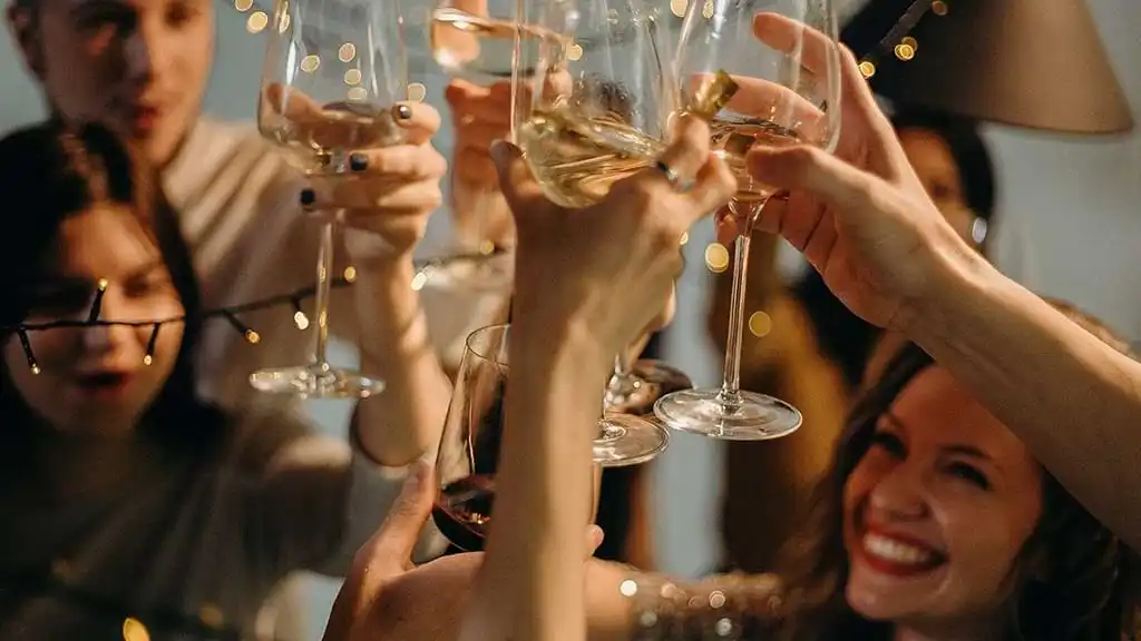 Guests raising their glasses making a toast